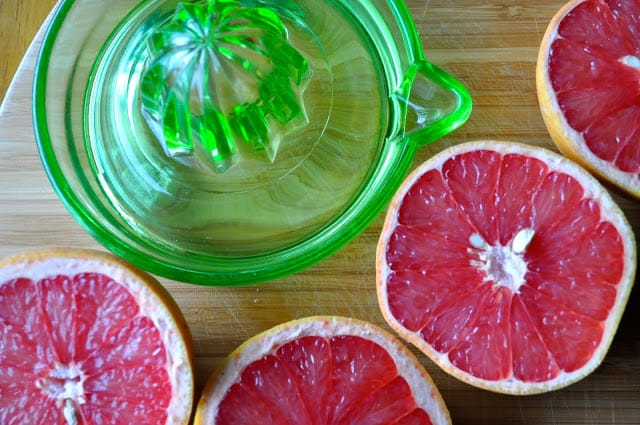 Halved grapefruit and a squeezer.