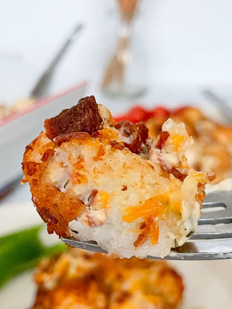 A single bite of chicken bacon ranch tater tot casserole.