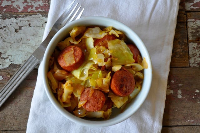 This recipe for Smothered Cabbage with Smoked Sausage was something I was pointed towards a few years ago when I was inundated with bountiful cabbage. #cabbagerecipe #southerncabbage #cabbagerecipes #quickdinnerrecipes #dinnerrecipe