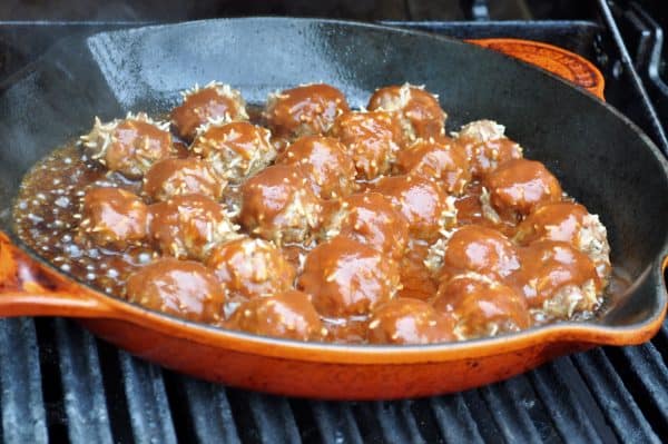 Procupine meatballs cooked on a grill pan. 