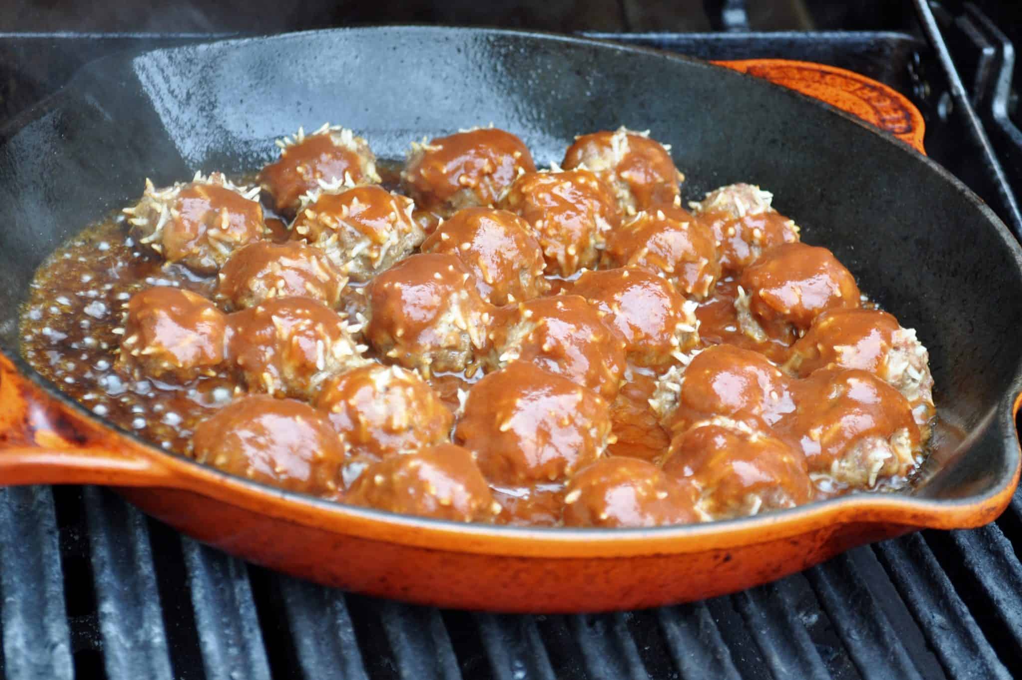 Procupine meatballs cooked on a grill pan.
