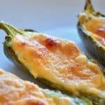 Close-up photo of oven baked cheesy jalapeño poppers.