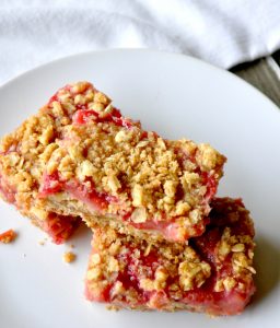 Stack of strawberry rhubarb oatmeal bars.