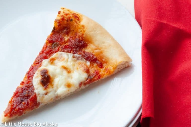 A slice of pizza margherita with American measurements.