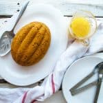 Classic steamed Victorian pudding Pumpkin pudding with a jar of vanilla hard sauce on the side.