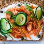 Perfect Smorrebrod with salmon cream cheese dill capers and cucumbers--an open face sandwich