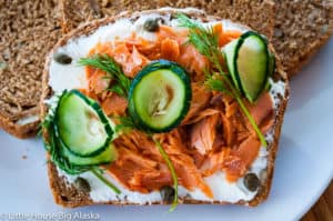 Perfect Smorrebrod with salmon cream cheese dill capers and cucumbers--an open face sandwich