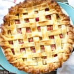 Top down shot of a lattice top rhubarb custard pie.
