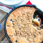 Blueberry coffee cake with streusel in a skillet.