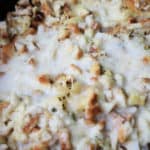 Easy crockpot dinner with stuffing mix, ham and melted cheese.