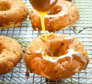 Caramel drizzled over the apple doughnuts.