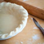 Easy homemade pie crust crimped and lined into the pie dish.