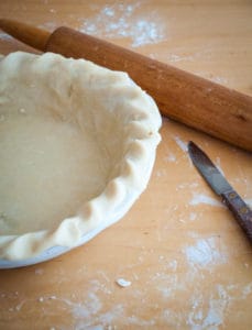 Easy homemade pie crust crimped and lined into the pie dish.
