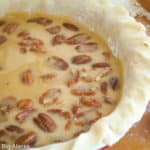 Chocolate pecan pie ready to be baked.
