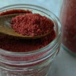 Peppermint sugar in a mason jar, a perfect homemade gift idea.