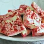 Stack of strawberry fudge with strawberry bits.