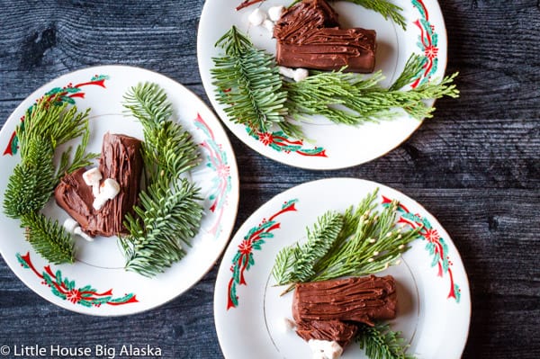 3 Christmas Plates with mini yule log cakes.