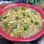 Instant pot white chicken chili topped with scallions.