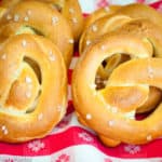 Golden brown, soft homemade pretzels sprinkled with coarse salt.