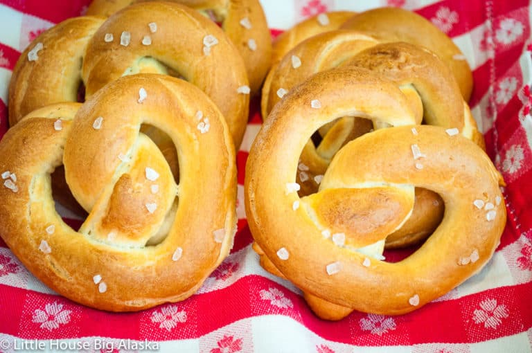 Golden brown, soft homemade pretzels sprinkled with coarse salt.