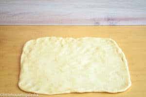 Patted-out dough for cinnamon crisp elephant ears.