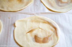 A cinnamon roll flattened to make an elephant ear.