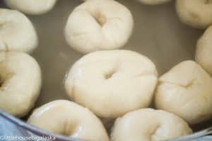 Mini bagels simmered in water.