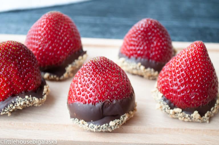 Berries stuffed with cheesecake dipped in chocolate and graham cracker crumbs. 