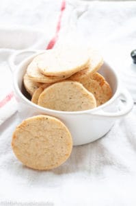 Stack of homemade parmesan crackers in a bowl.