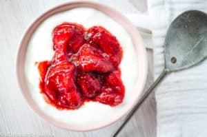 Roasted strawberries served over fresh yogurt.