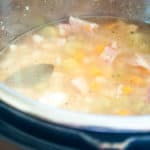 Navy bean and bacon soup simmering in the instant pot.