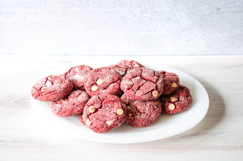 Red velvet cookies rolled in sugar.