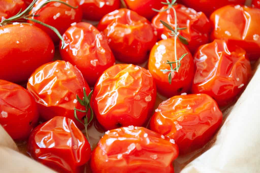 Close up photo of oven roasted grape tomatoes.