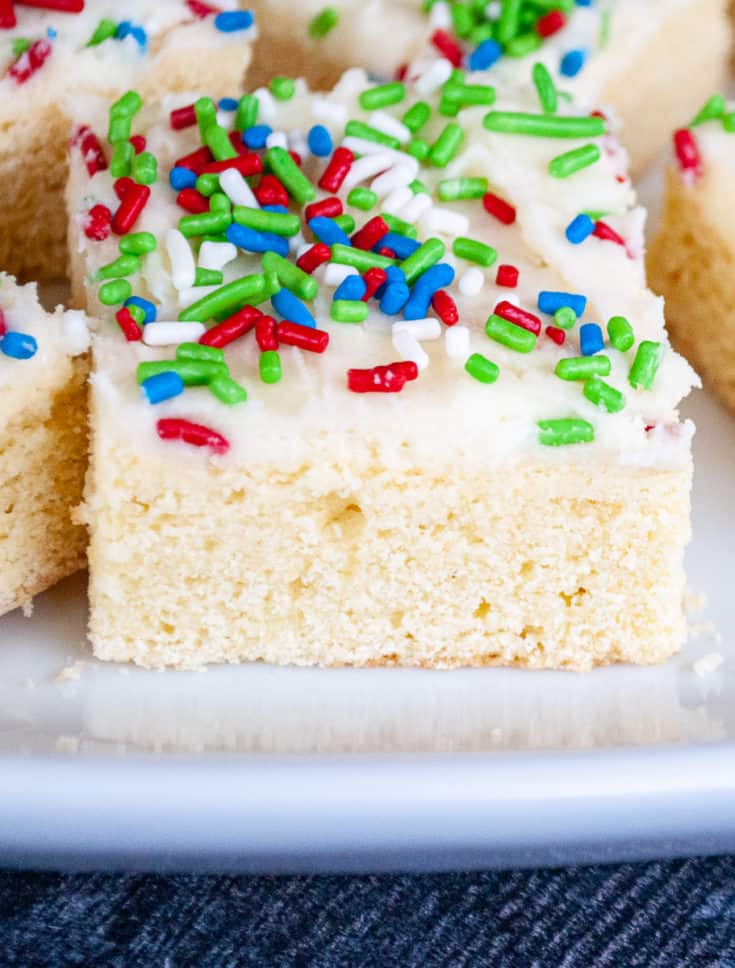 Slices of sugar cookies topped with colorful sprinkles. 