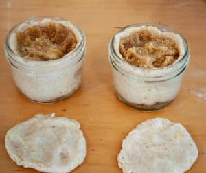 Rolled two pieces of reserved dough into lids.