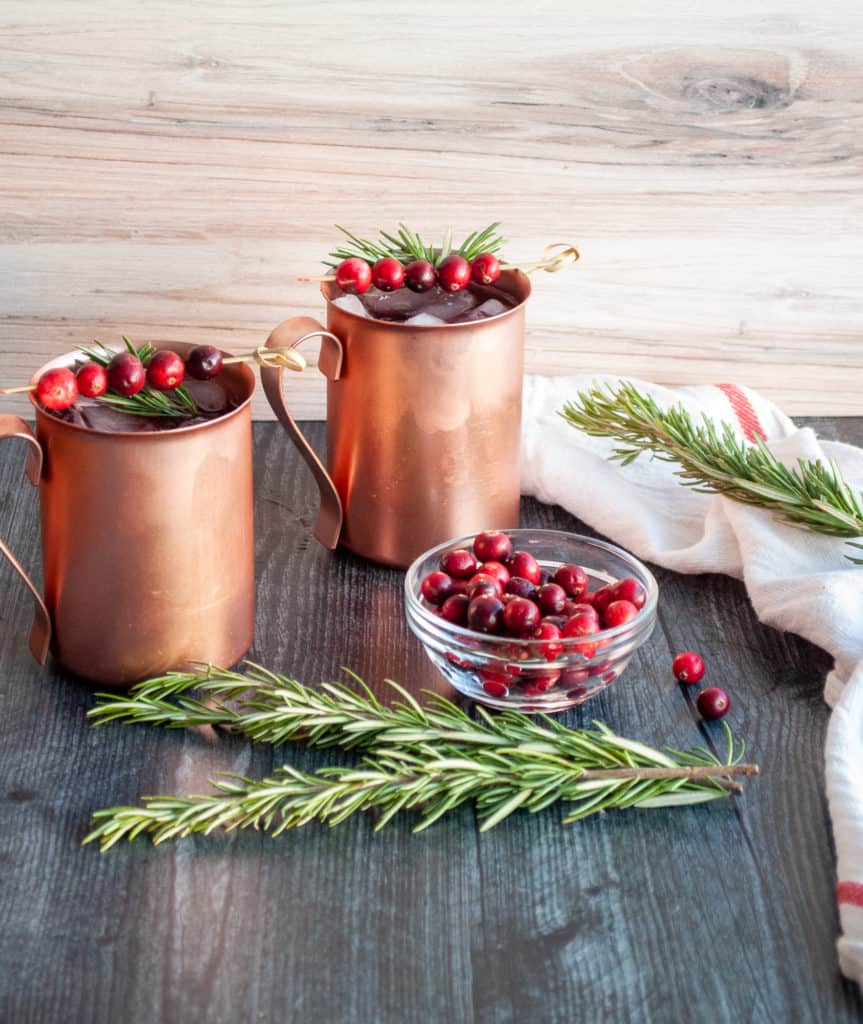 Refreshing christmas cocktails in copper mugs.