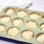 Savarin Cake dough in a muffin tin.