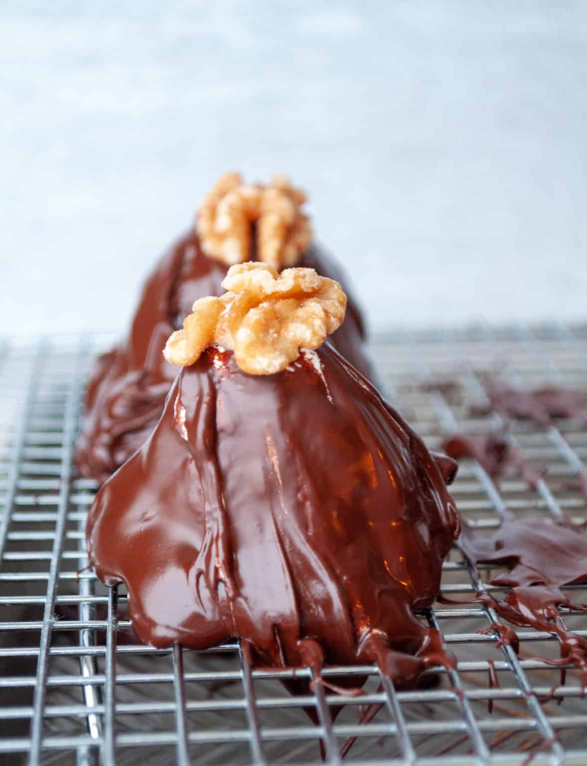 Walnut whirls coated with melted chocolate.