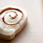 A cinnamon roll about to be flattened.