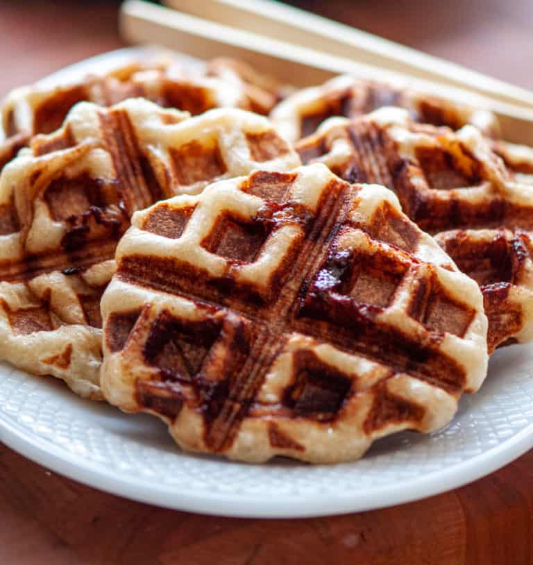 Cinnamon roll waffles in a white plate.