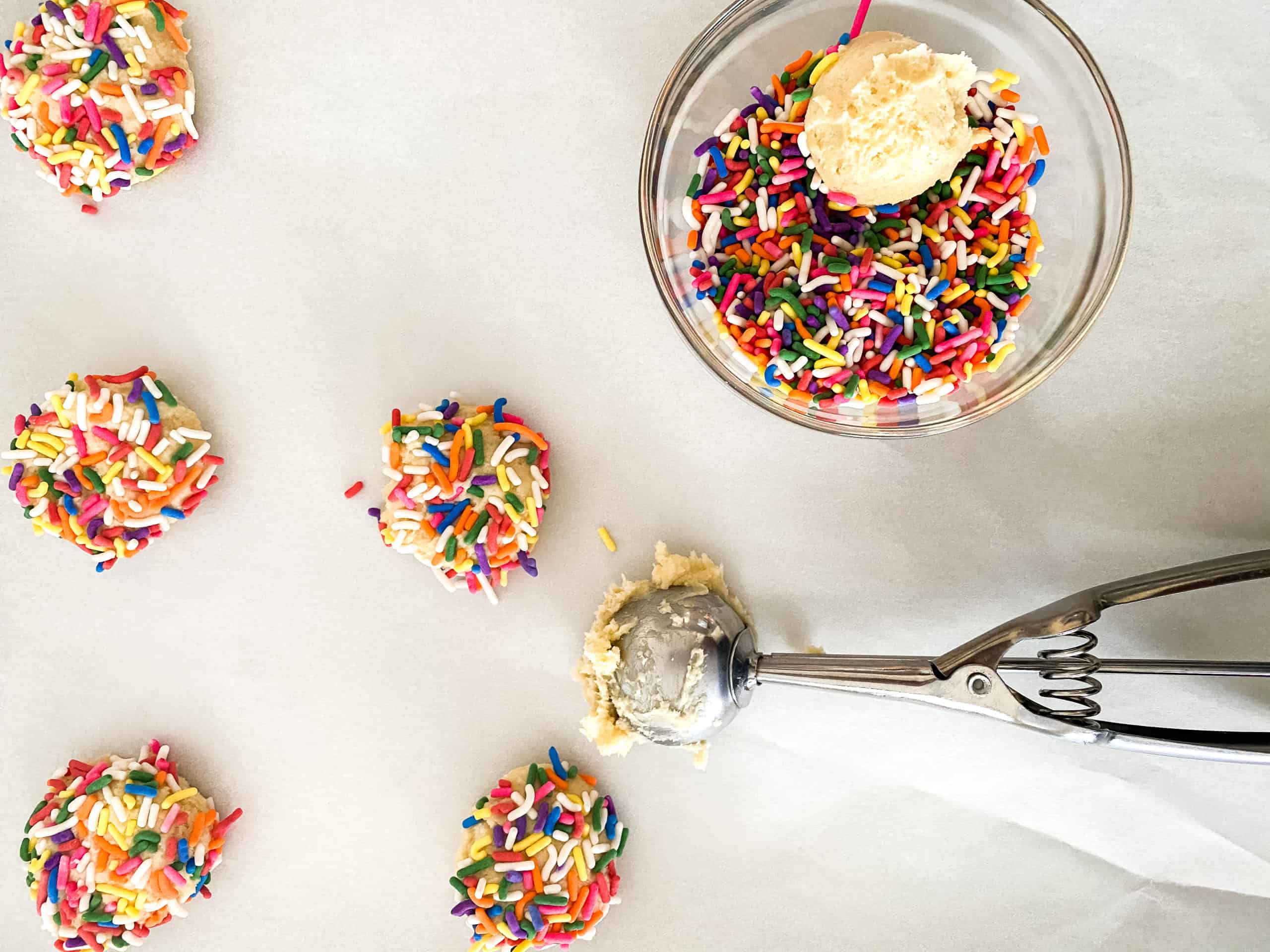 Drop the cookie dough in sprinkles before baking,