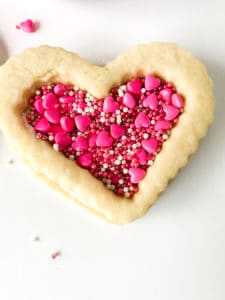 Single filled heart shaped valentine cookie.