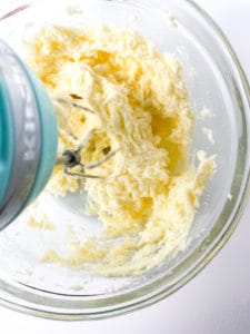 Cream the cream cheese, butter, and sugar for these red velvet cut-out cookies.