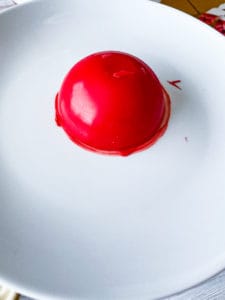 Melting the edge of the cocoa bomb shell.