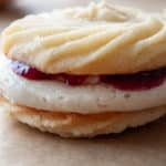 Close up of a single cookie on parchment paper.