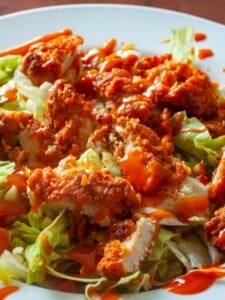 Buffalo chicken on a salad.