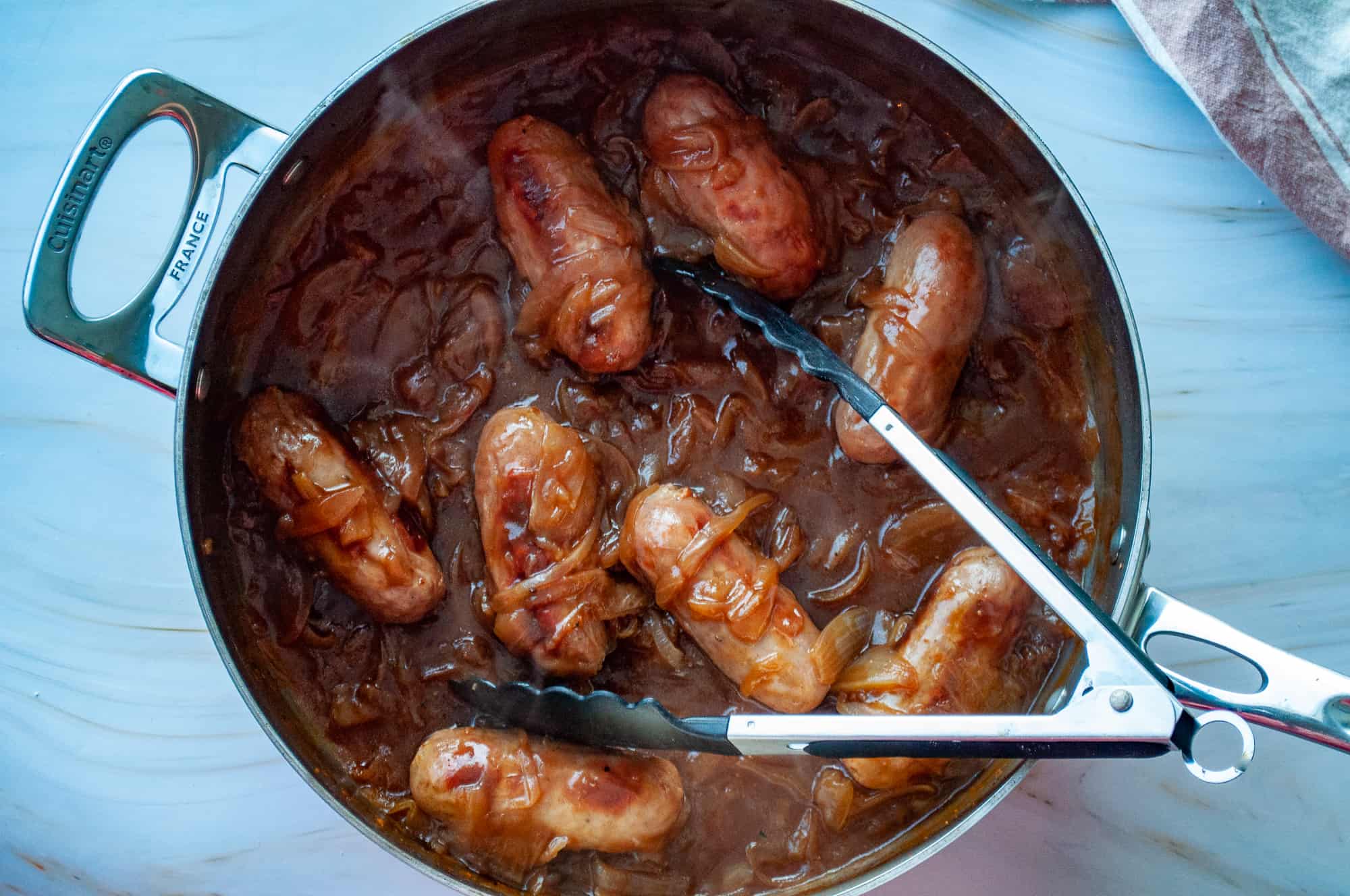 A plate with mash and sausage. 