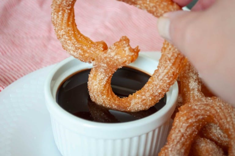 Heart Shaped churros in chocolate sauce.
