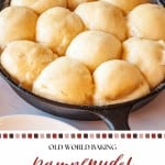 A cast iron skillet filled with golden, puffy yeast dumplings, known as Dampfnudel, sits on a light countertop. The soft Dampfnudel rise beautifully in the pan, their delicate crust glistening invitingly.