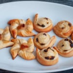 Assorted Danish pastries on a white plate.